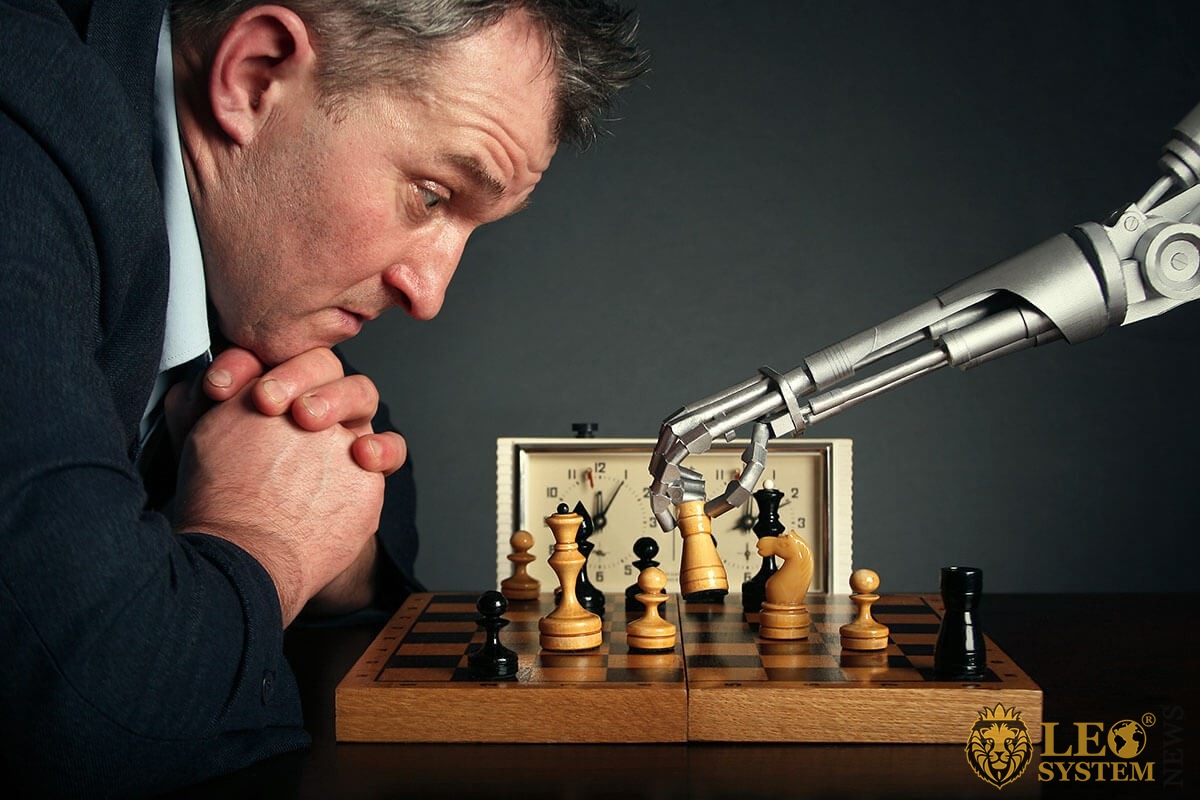 Man and robot play chess
