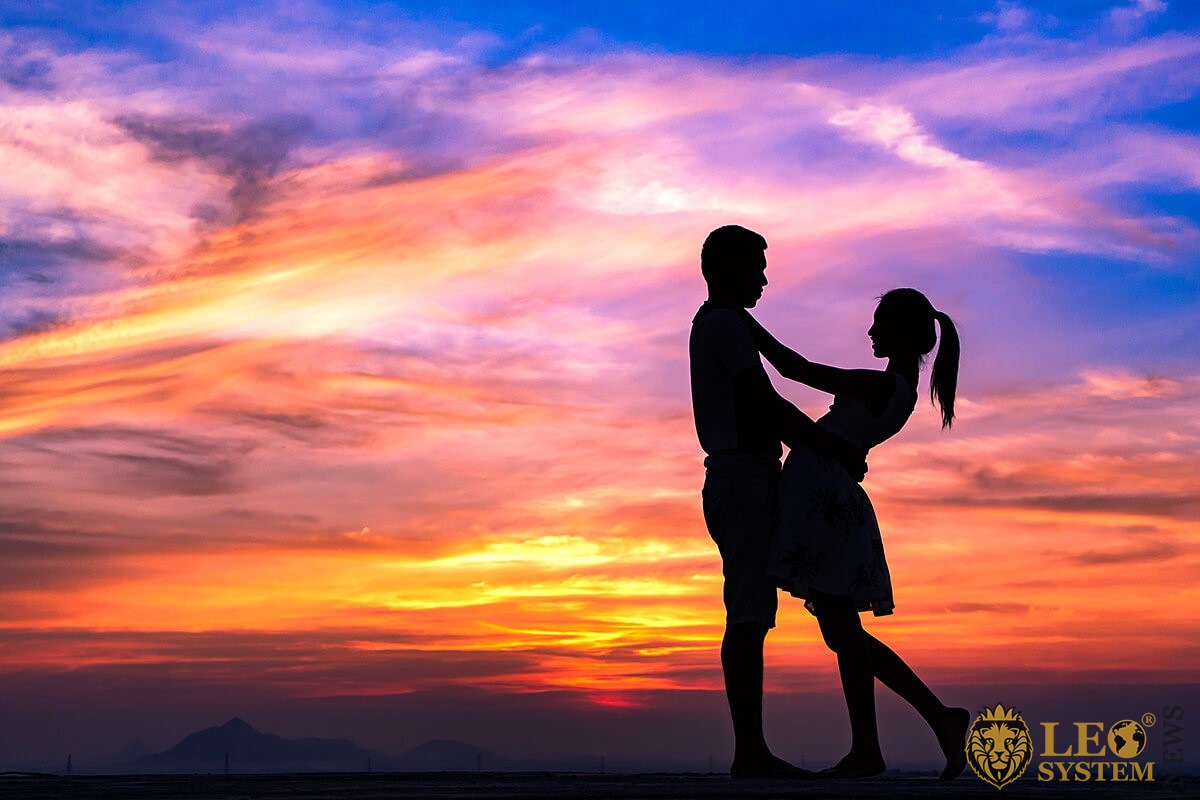 Image of a romantic couple at sunset