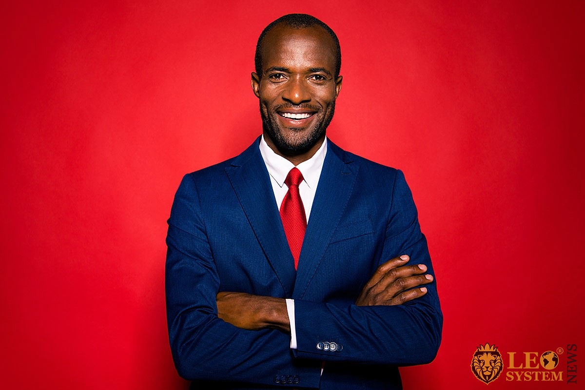 Image of a man in a business suit and red tie