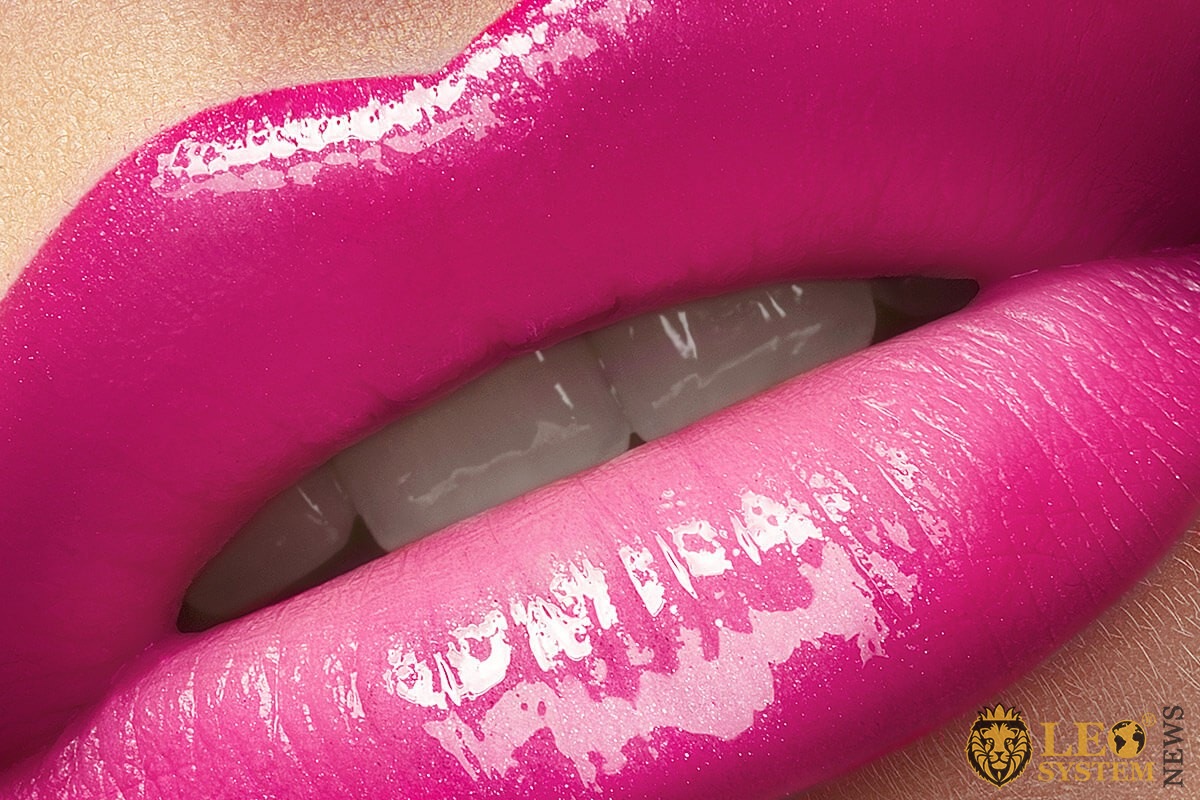 Image of attractive female lips with bright pink lipstick