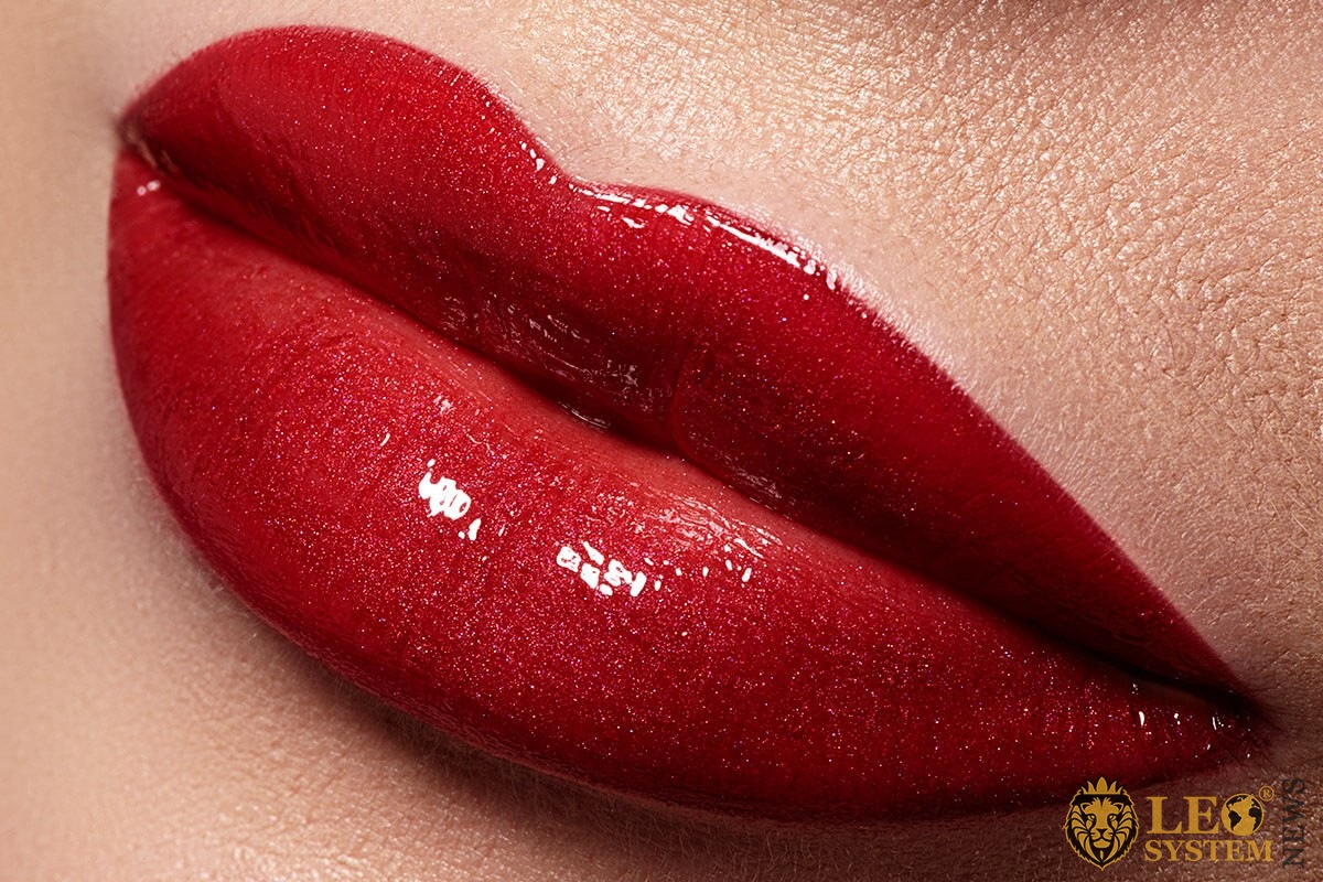 Image of beautiful female lips with bright red lipstick