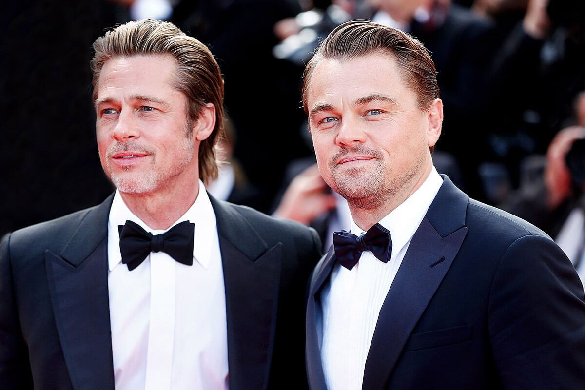 Image of smiling Brad Pitt and Leonardo DiCaprio