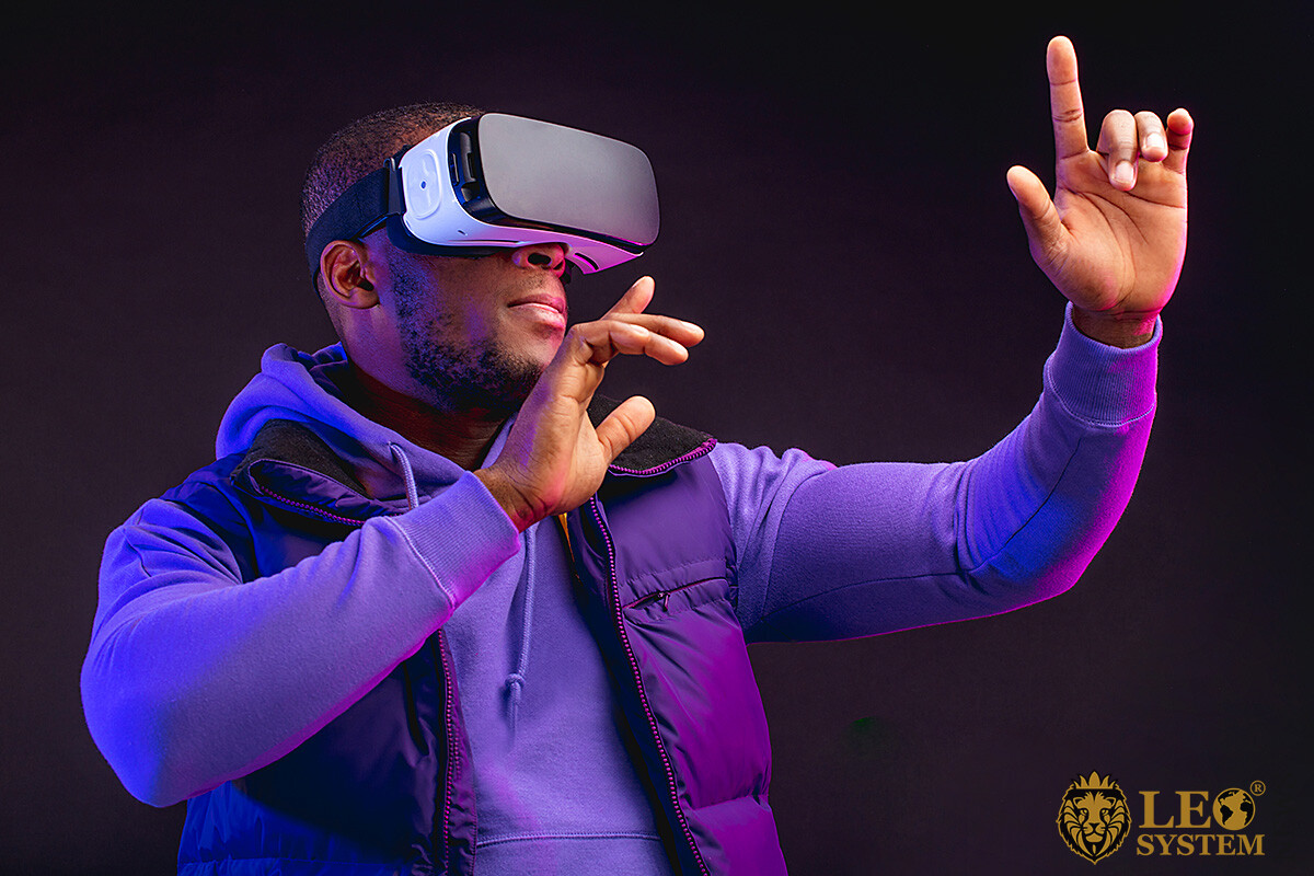 Image of a man wearing virtual reality glasses