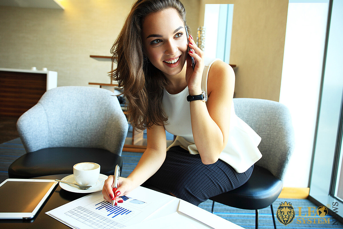 Business woman with mobile phone and tablet