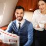 Image of a business couple on board an airplane