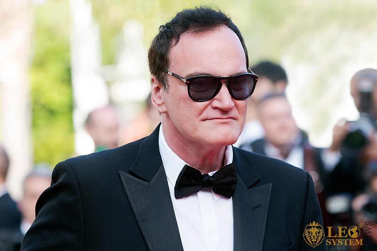 Image of Quentin Tarantino in suit and sunglasses