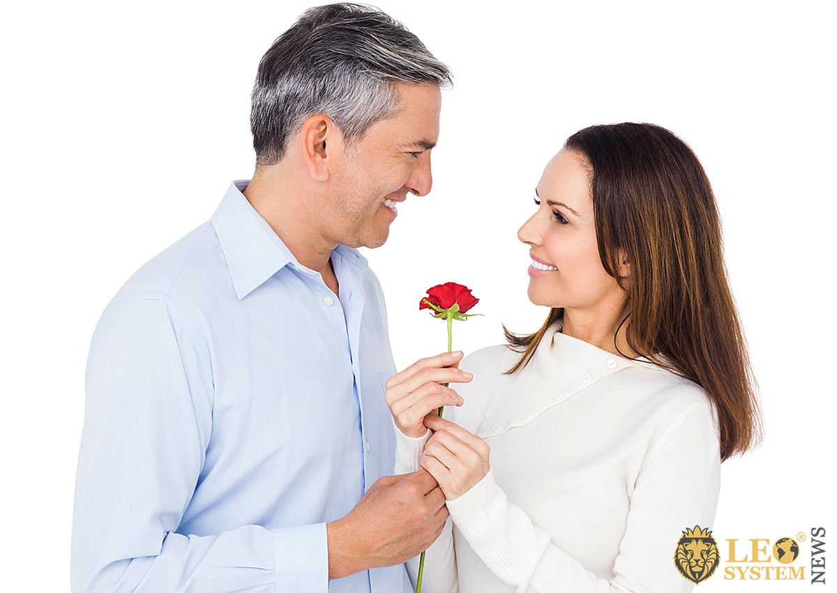 Man giving flowers to beautiful girl