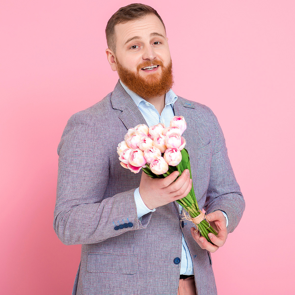 Handsome man with a bouquet of flowers