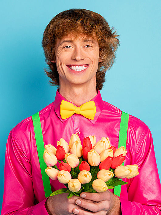Image of a cheerful young man with flowers