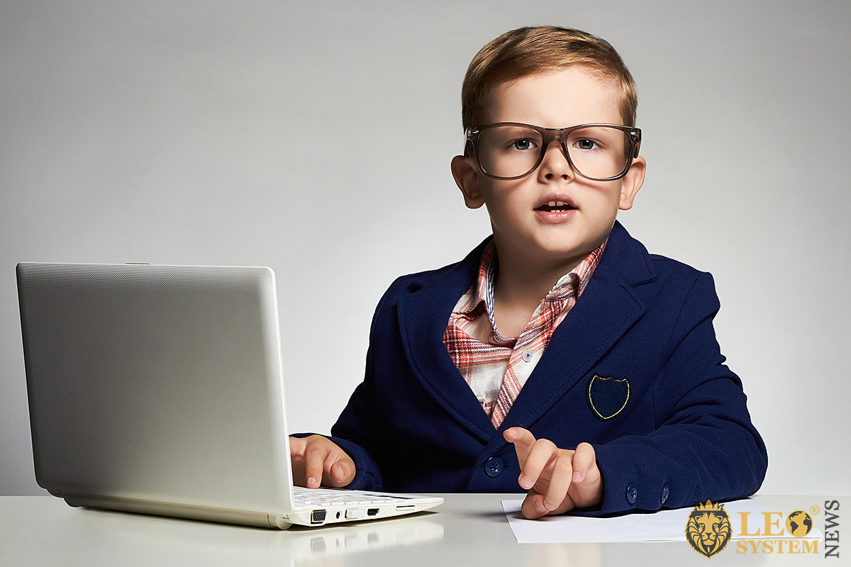 Image of a smart child with a laptop